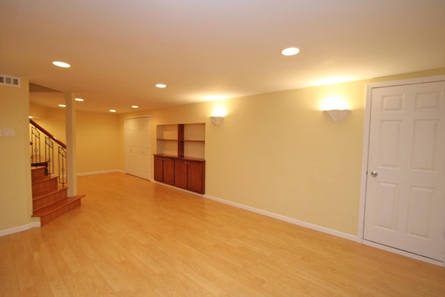 basement featuring light hardwood / wood-style floors