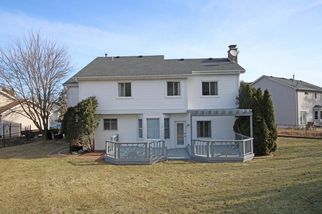 deck featuring a pergola and a lawn