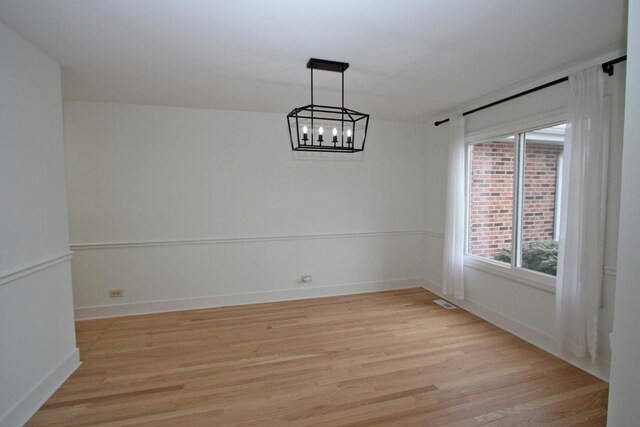 interior space with high vaulted ceiling and light hardwood / wood-style flooring