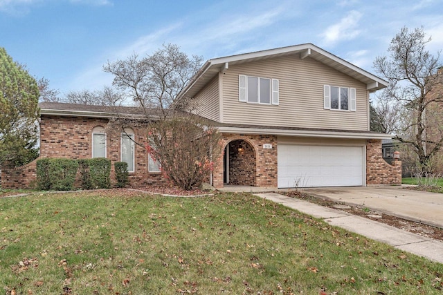 view of front facade featuring a garage and a front lawn