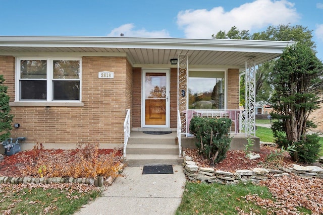 entrance to property featuring covered porch