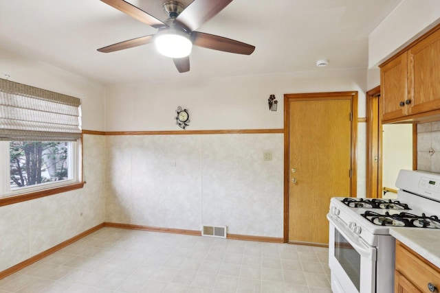 kitchen with ceiling fan and gas range gas stove