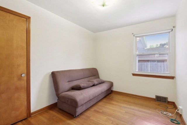 sitting room featuring light hardwood / wood-style flooring