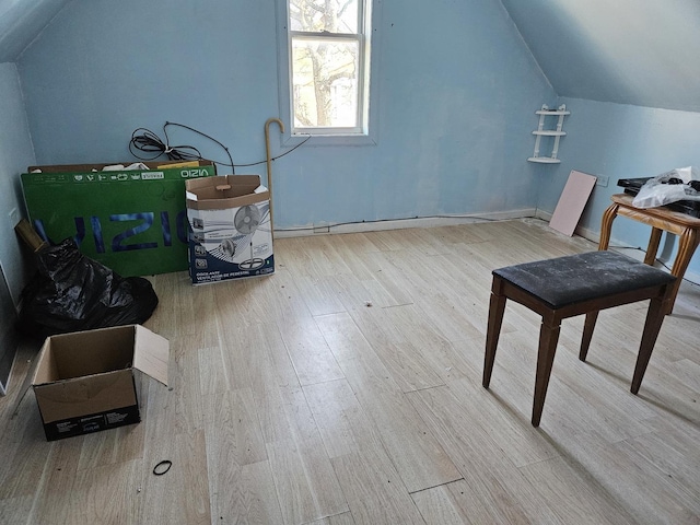 bonus room featuring light hardwood / wood-style flooring and lofted ceiling