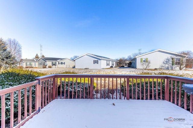 view of snow covered deck