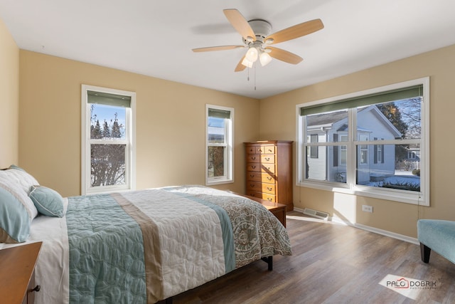 bedroom with hardwood / wood-style flooring and ceiling fan