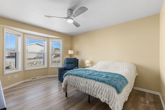 bedroom featuring wood-type flooring and ceiling fan