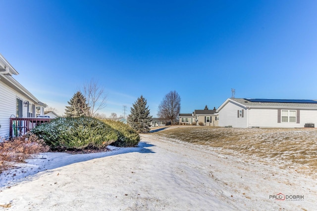 view of yard layered in snow