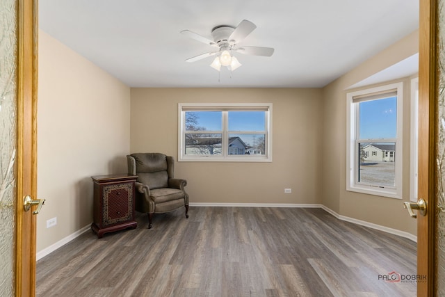 unfurnished room with dark wood-type flooring and ceiling fan