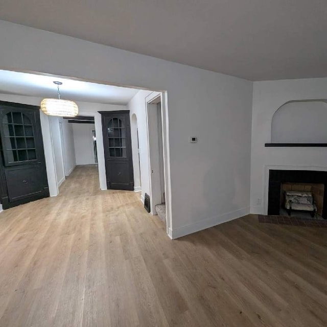 unfurnished living room with hardwood / wood-style floors