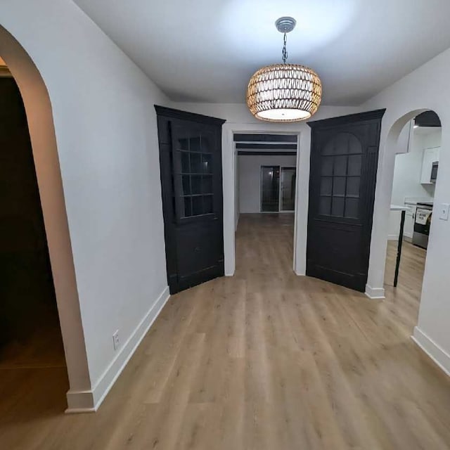 unfurnished dining area with light hardwood / wood-style floors