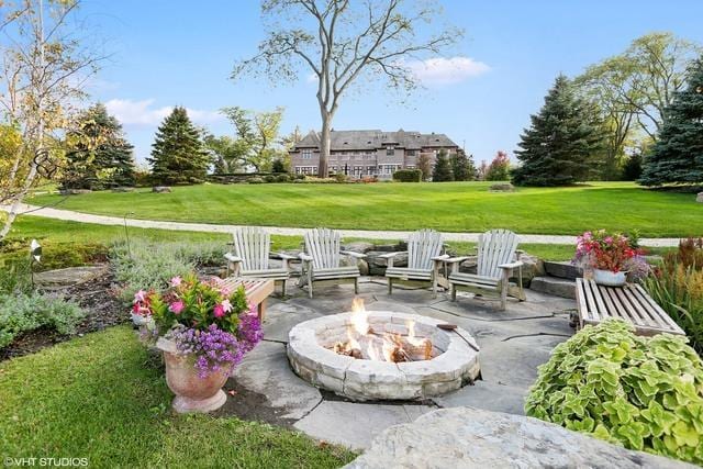 view of patio / terrace featuring an outdoor fire pit