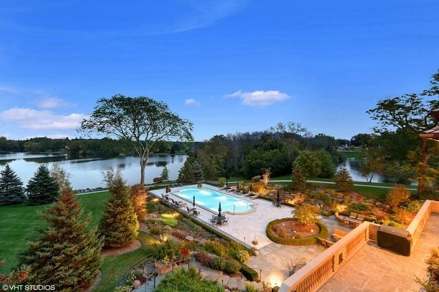 view of pool with a patio area and a water view