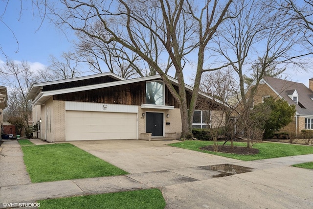 mid-century home with driveway, brick siding, a front lawn, and an attached garage