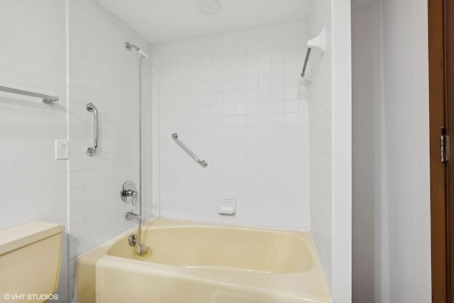 bathroom with toilet and shower / bathing tub combination