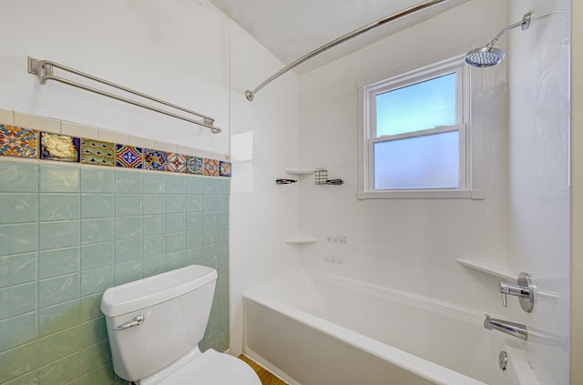 bathroom featuring shower / tub combination and toilet