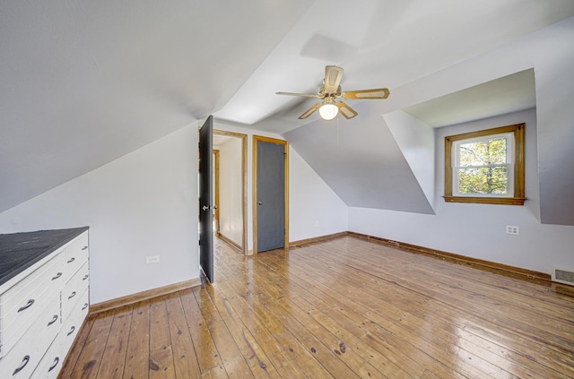 additional living space with ceiling fan, light hardwood / wood-style floors, and lofted ceiling