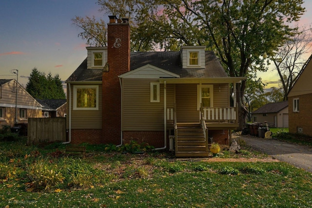 view of front of property with a yard