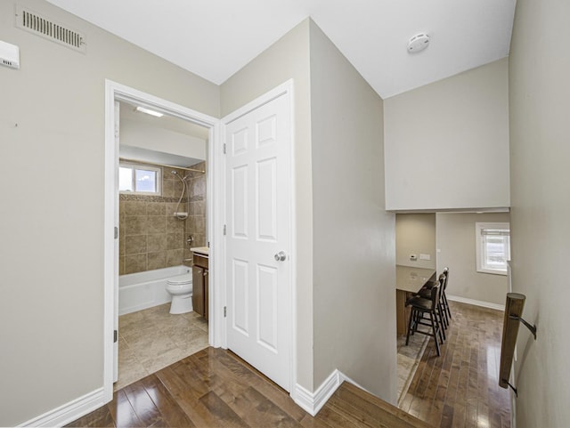 hall with dark wood-type flooring