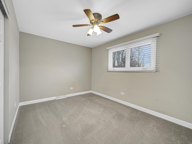 empty room with light carpet and ceiling fan