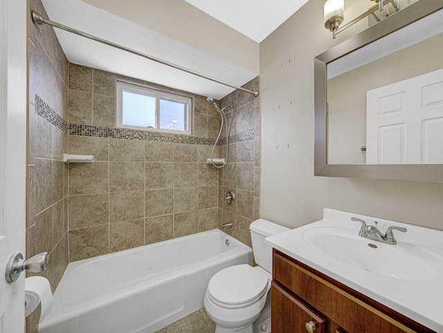 full bathroom with toilet, vanity, tiled shower / bath combo, and tile patterned flooring