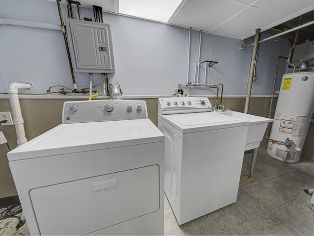 laundry room featuring washer and clothes dryer, gas water heater, and electric panel