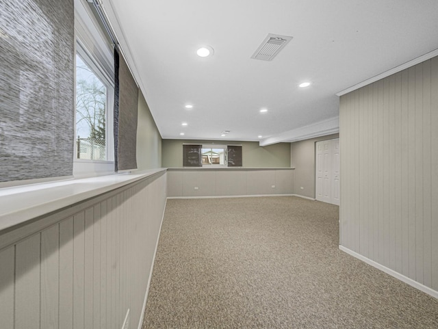 carpeted empty room with ornamental molding