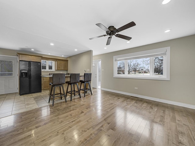 dining space featuring light hardwood / wood-style flooring and ceiling fan