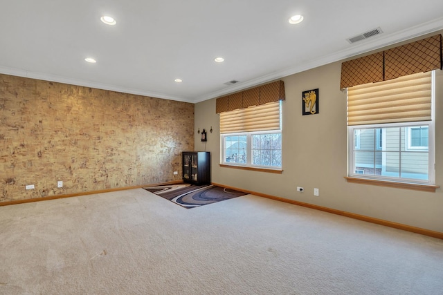 unfurnished living room featuring carpet floors and crown molding