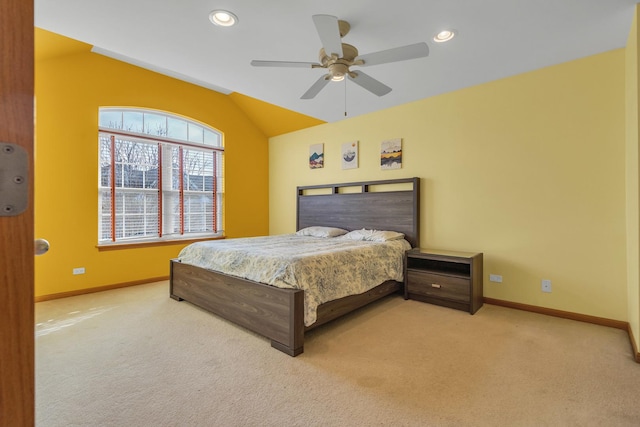 bedroom featuring ceiling fan, light carpet, and vaulted ceiling