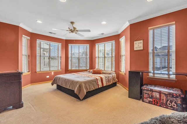 bedroom with light colored carpet, ceiling fan, and crown molding