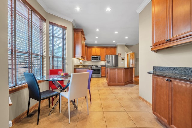 tiled dining area featuring crown molding