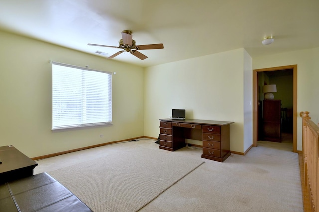 office area featuring light carpet and ceiling fan