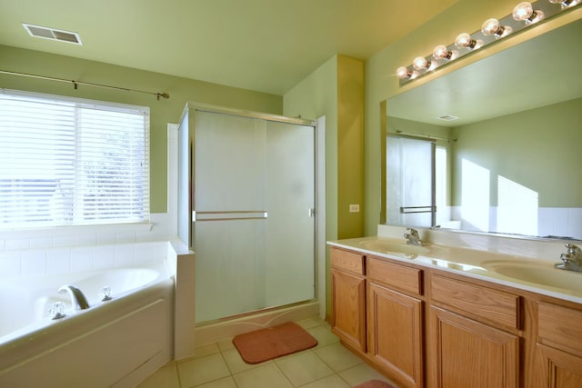 bathroom featuring tile patterned flooring, vanity, and independent shower and bath