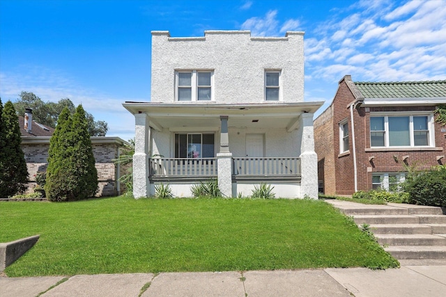 view of front facade featuring a porch and a front lawn