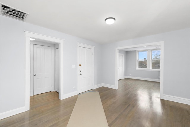 foyer with dark wood-type flooring