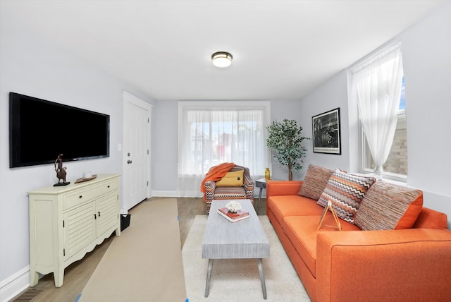 living room with light hardwood / wood-style flooring