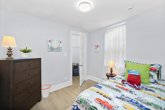 bedroom with light hardwood / wood-style flooring