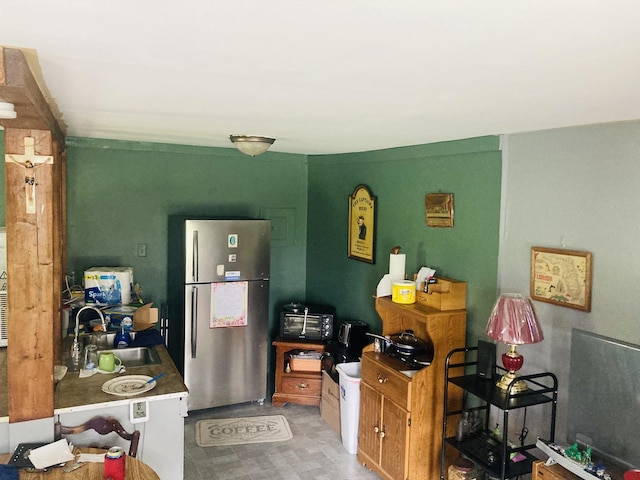 kitchen with stainless steel refrigerator and sink