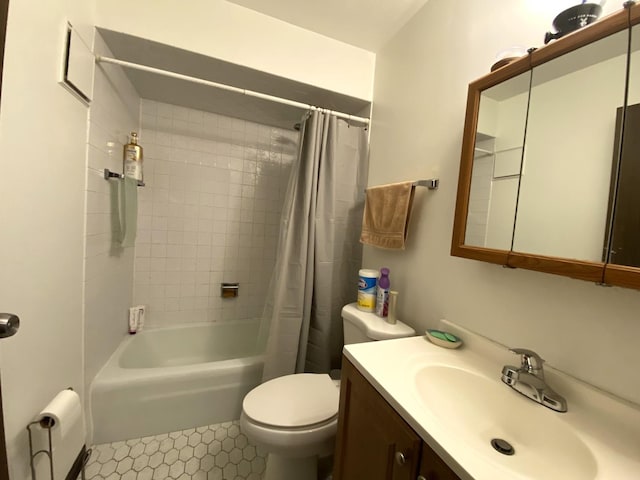 full bathroom featuring tile patterned flooring, shower / bath combo, toilet, and vanity