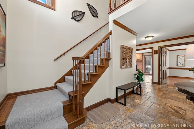 staircase with ornamental molding