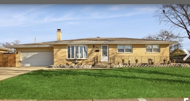 ranch-style house with a front yard and a garage