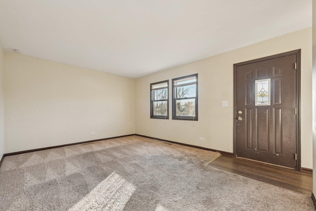 view of carpeted foyer