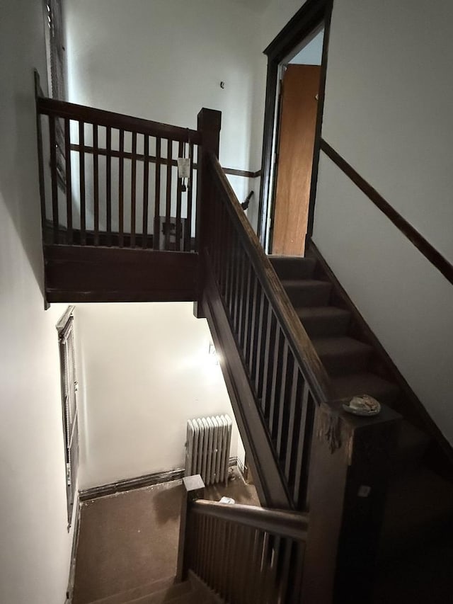 staircase with radiator heating unit