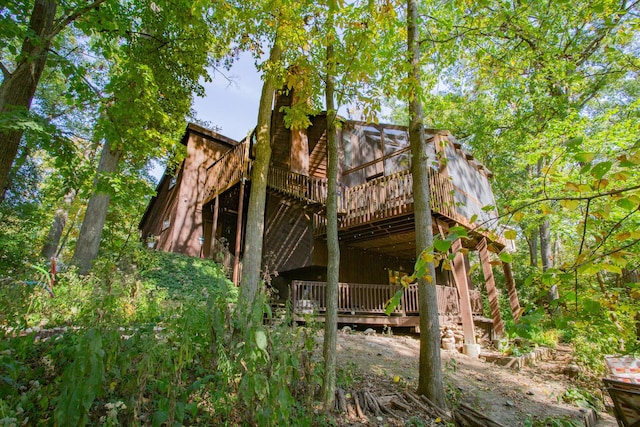 back of property featuring a wooden deck