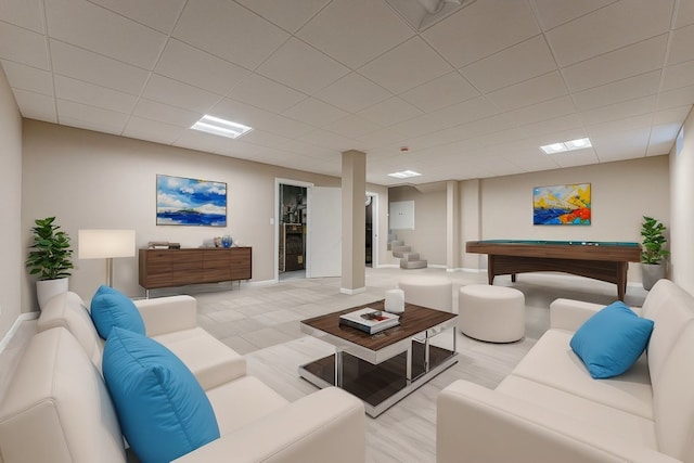 living room featuring a paneled ceiling and pool table