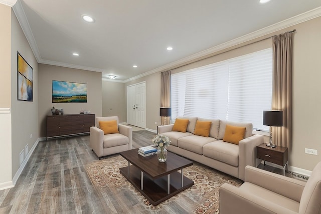 living room featuring wood-type flooring and crown molding