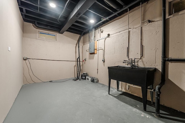 basement featuring electric panel