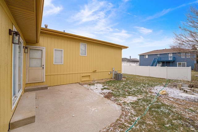 view of property exterior featuring central air condition unit and a patio