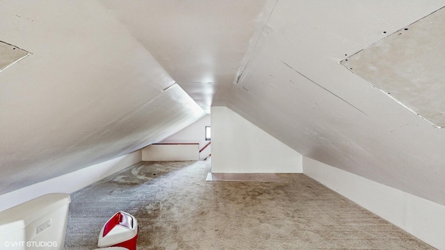 bonus room featuring carpet flooring and lofted ceiling